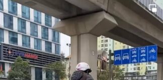 At least she is wearing a helmet!