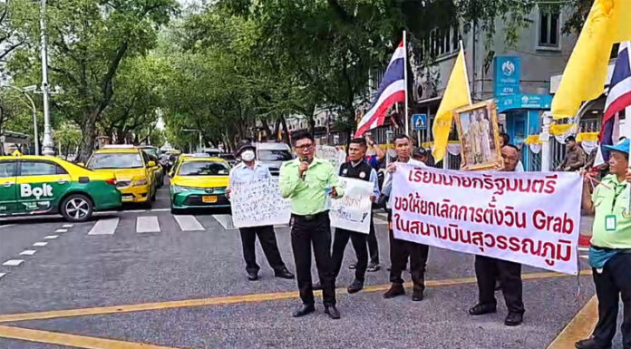 Angry Bangkok cabbies demand the government cancel Grab services at Suvarnabhumi Airport.